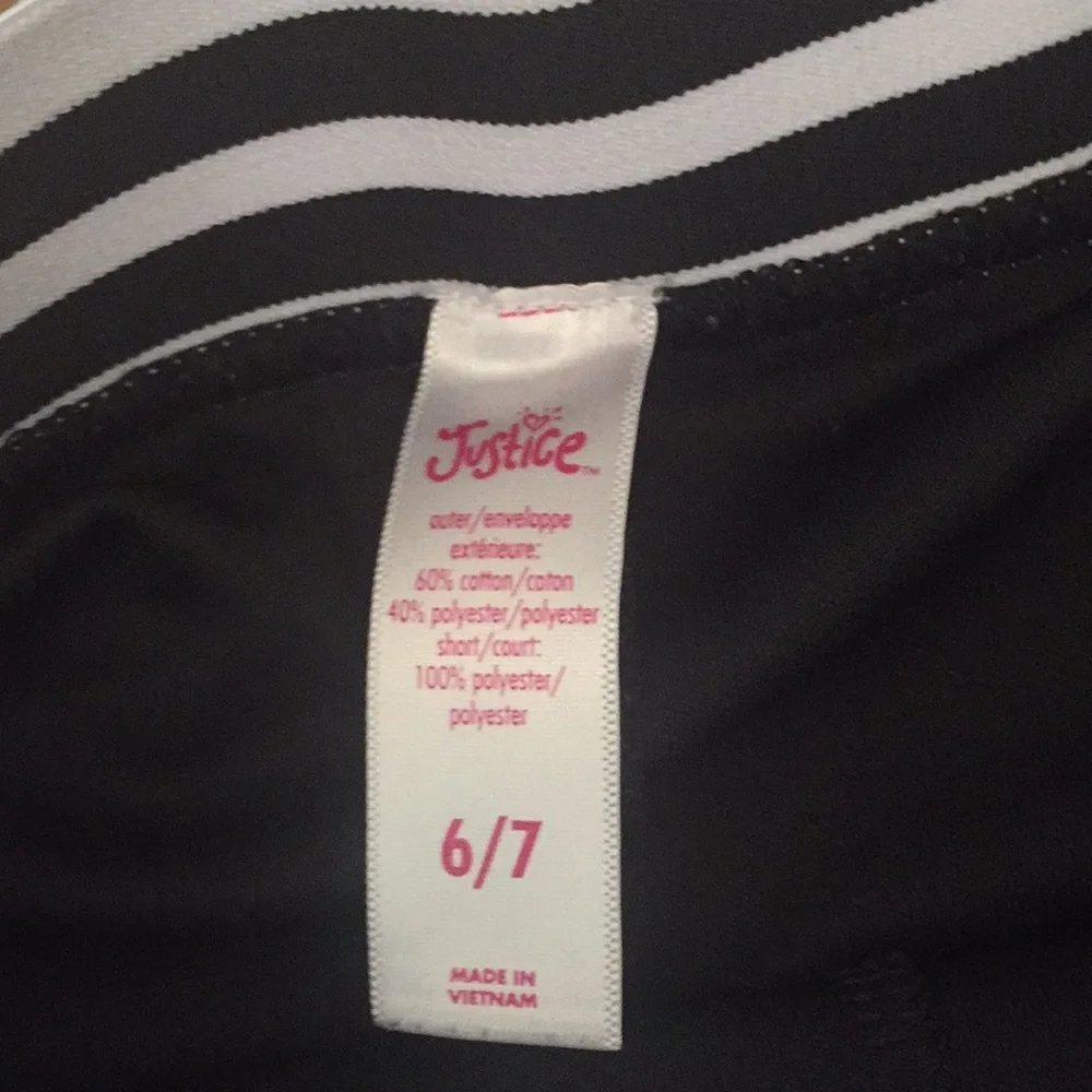 Justice skort black with white stripes on waist‎ band size 6/7